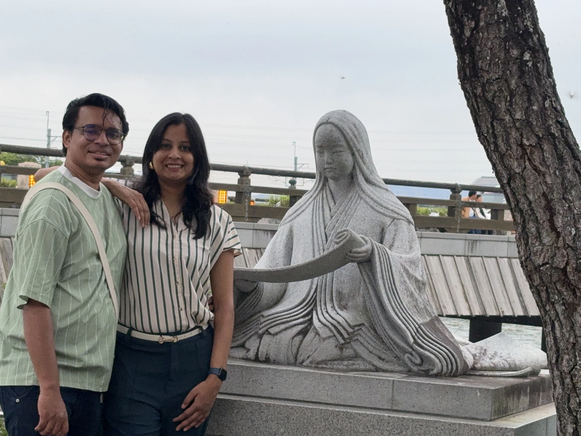 Posing with the Murasaki Shikibu statue at Uji bridge