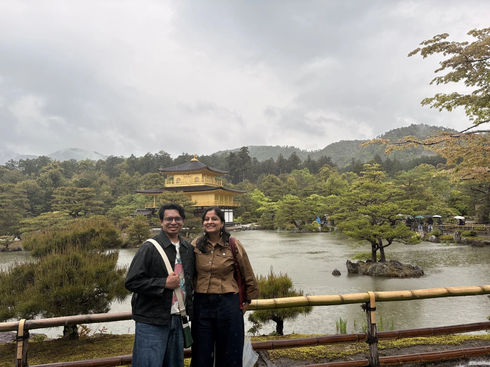 The Golden Temple reflected in its pond, in soft rain