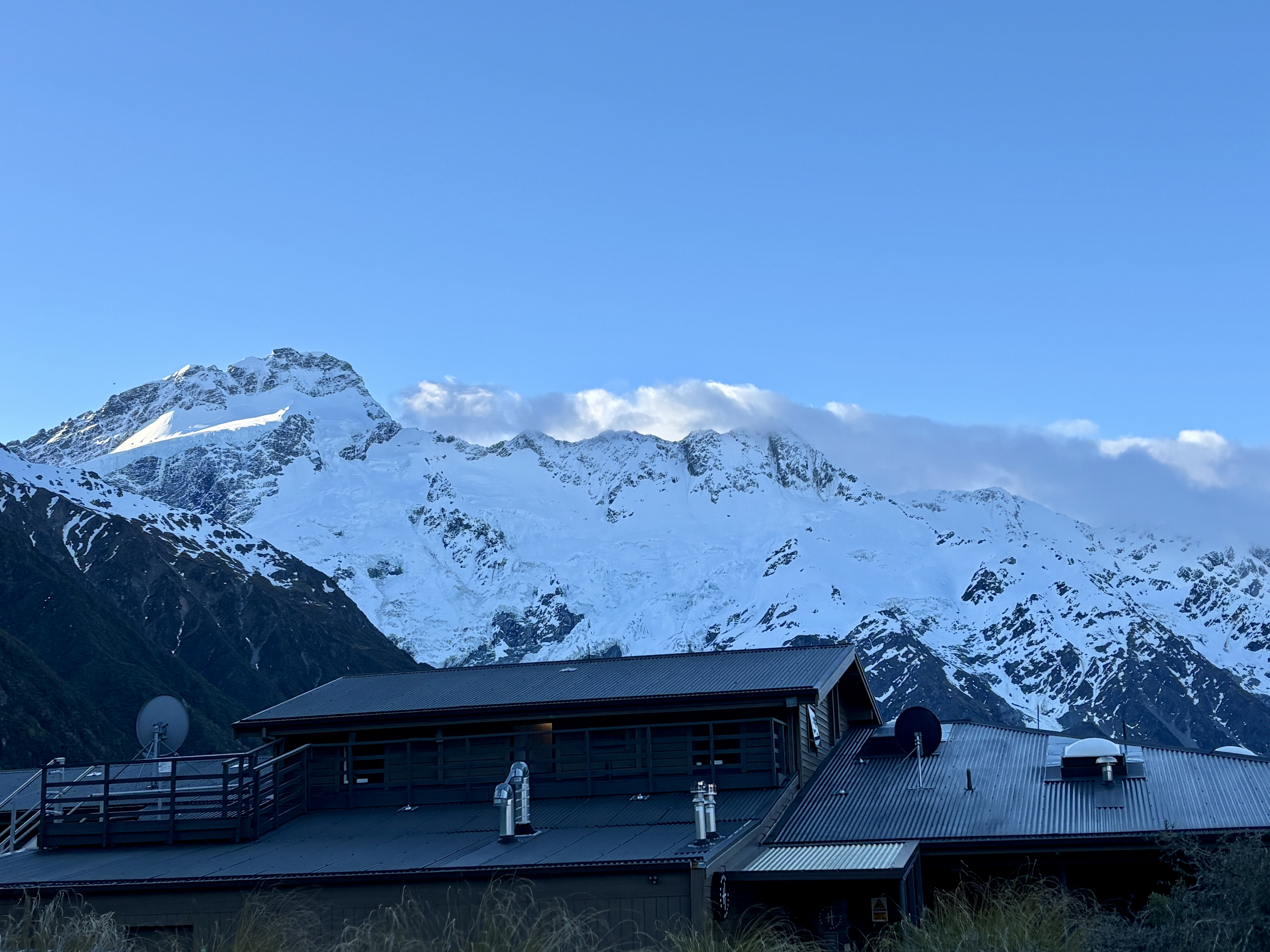 Snowy majestic peak of Aoraki Mount Cook rising under clear blue sky