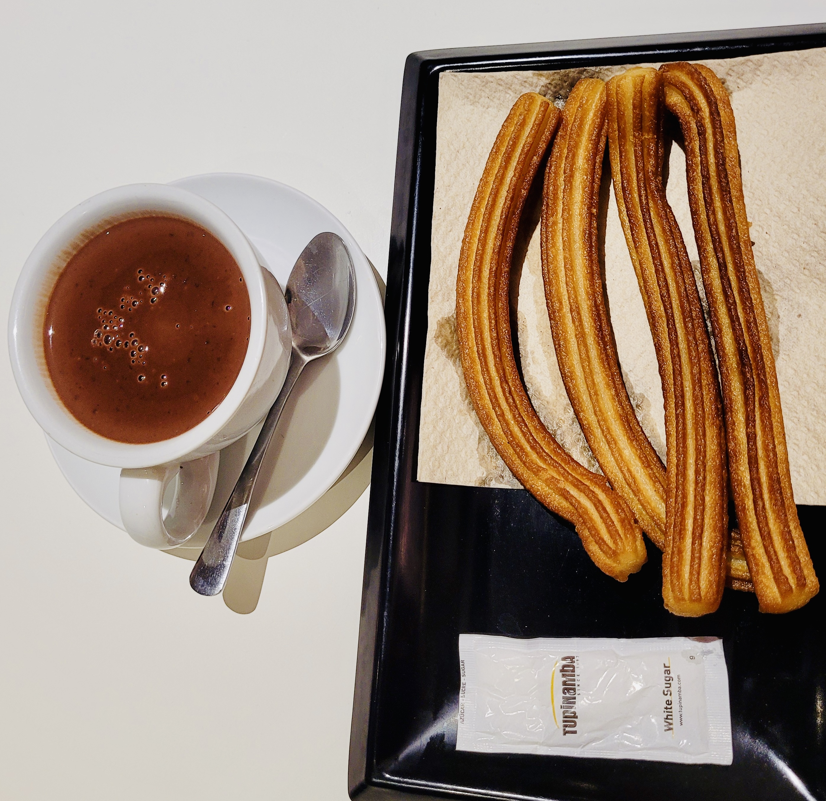 Hot churros served with thick hot chocolate