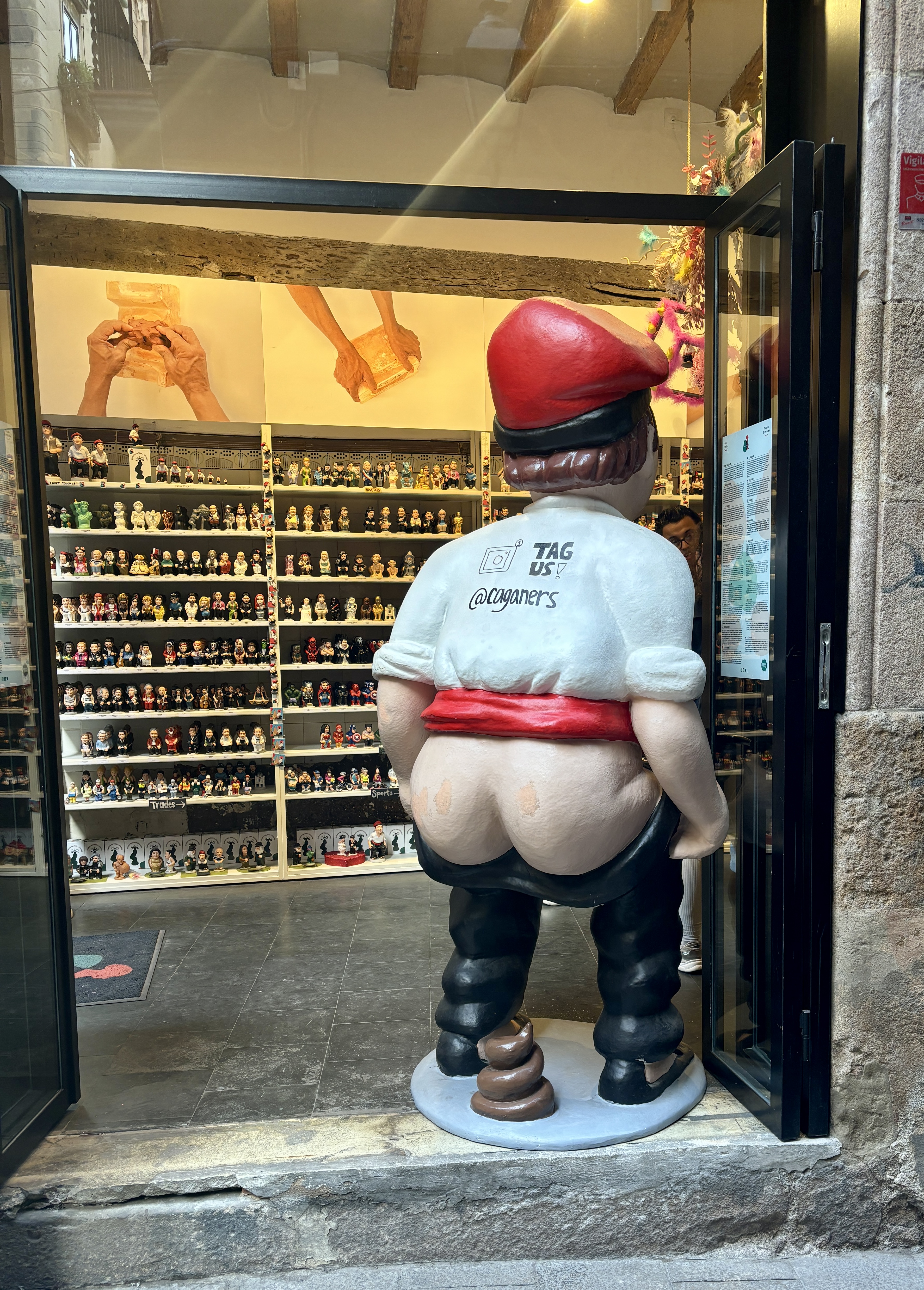 Quirky pooper figurines (Caganer) in a shop window