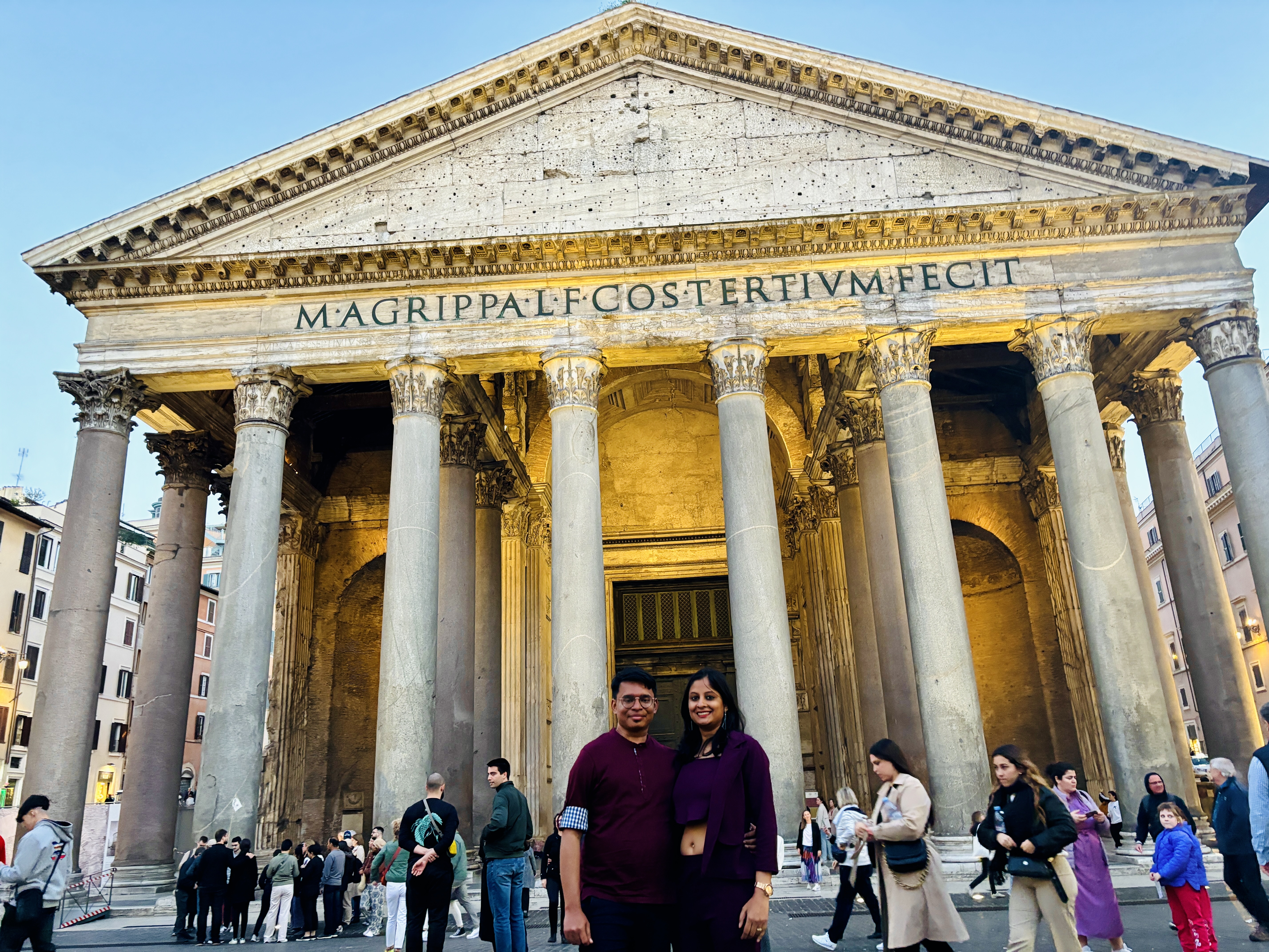 Looking up at the giant ancient stone facade of the Pantheon in Rome
