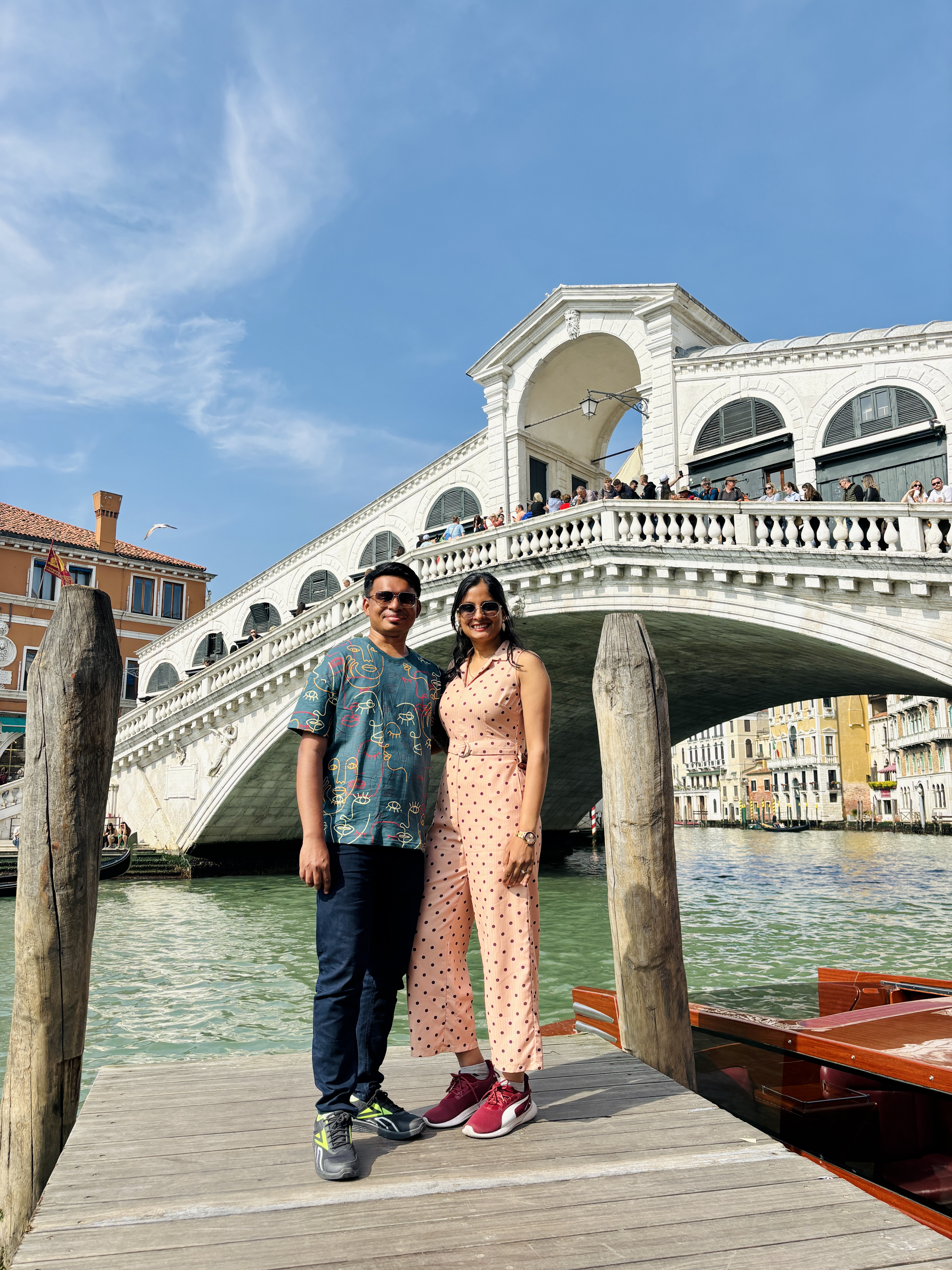 Stunning stone arches of the Rialto Bridge spanning the Grand Canal
