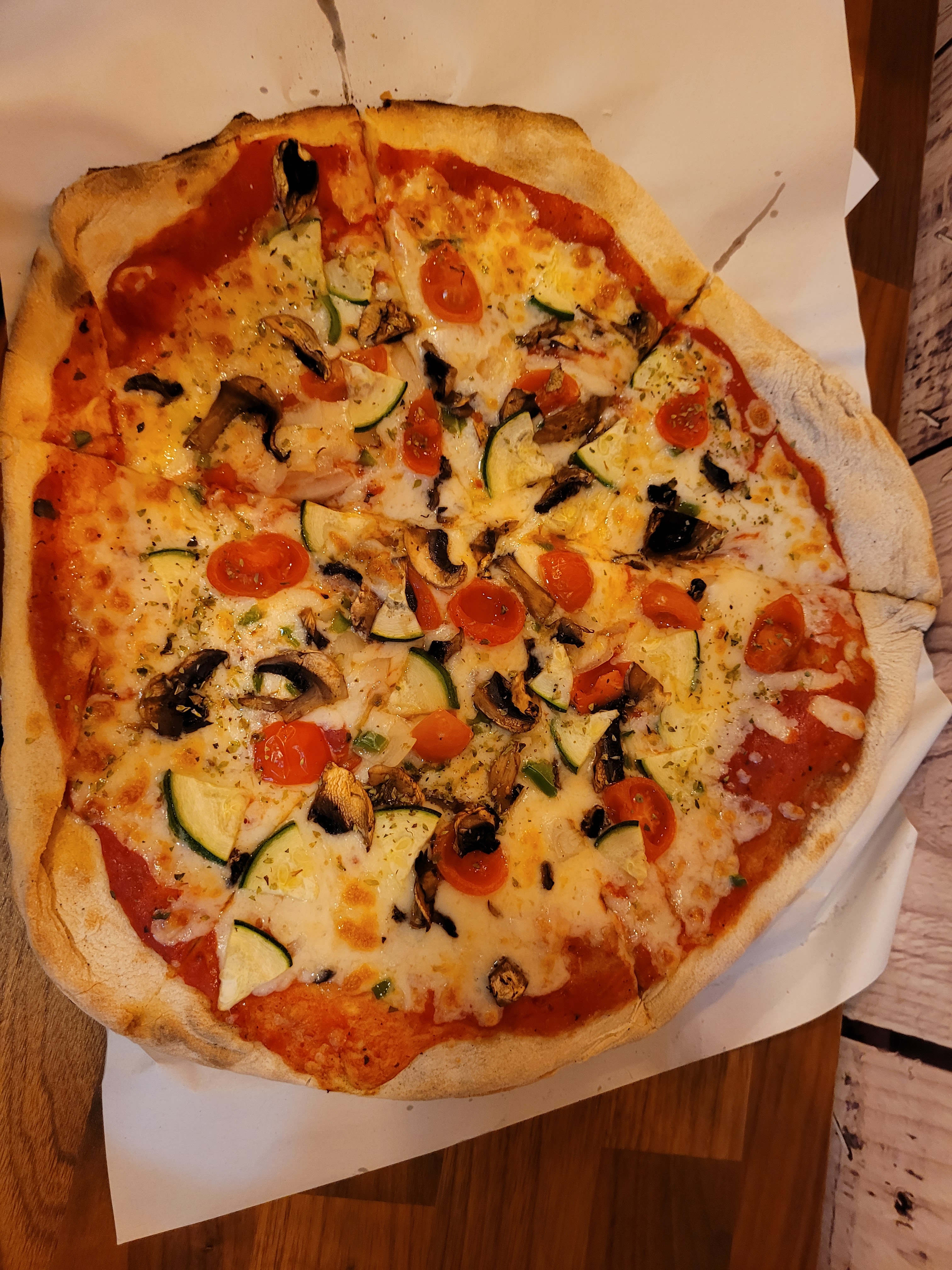 Freshly baked artisanal vegetarian pizza in Seville