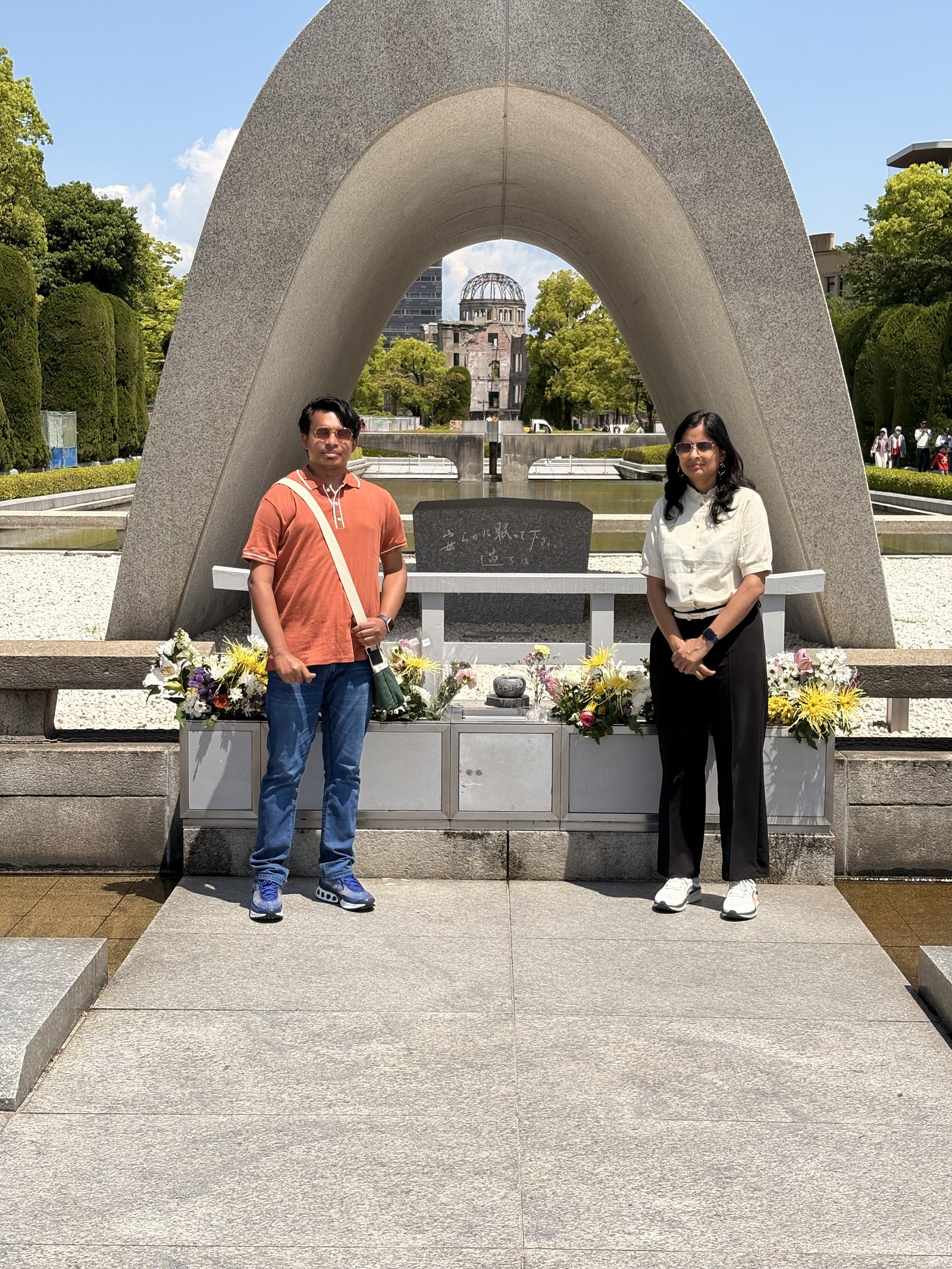 Standing at the Cenotaph in Peace Memorial Park with the A-Bomb Dome framed through the arch