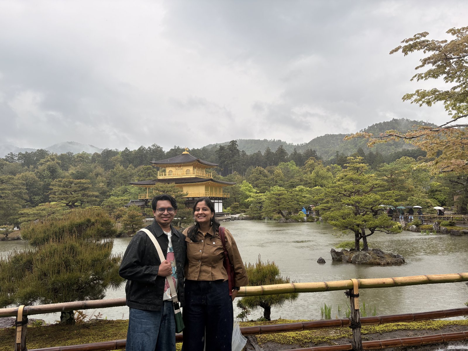 The Golden Temple reflected in its pond, in soft rain